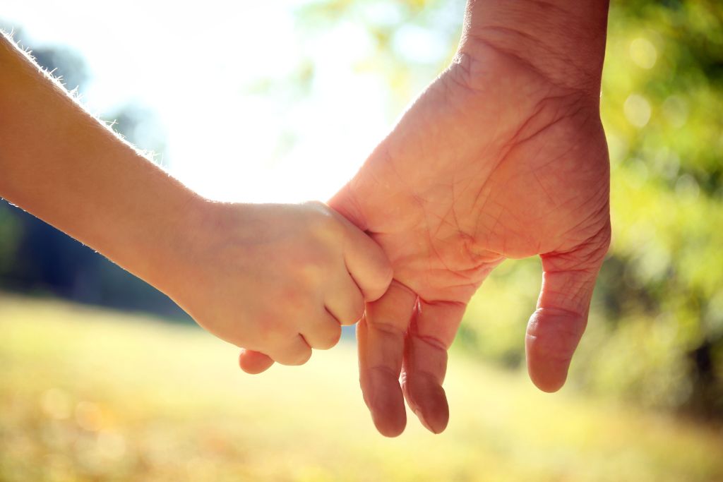 Child holding the parents hand